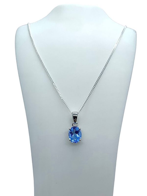 Silver Blue Topaz Oval Cut Pendant and Earring Set