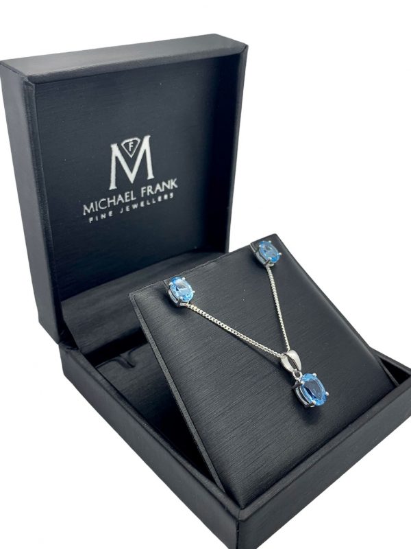 Silver Blue Topaz Oval Cut Pendant and Earring Set